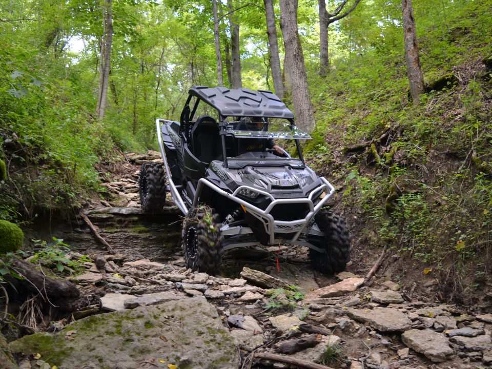 A UTV takes on tough rocky terrain