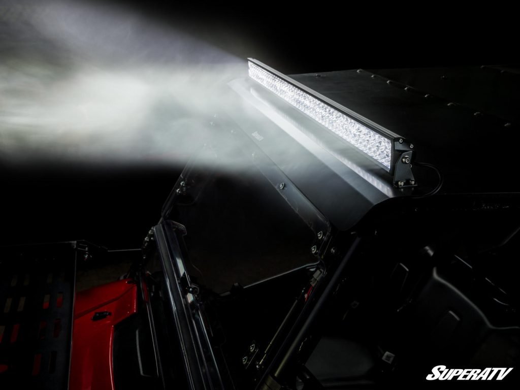 A roof-mounted light bar shining a bright light.