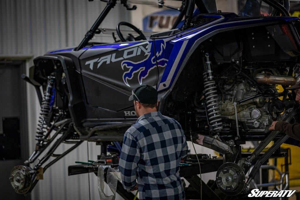 A Honda Talon on the lift for new tires and maintenance.