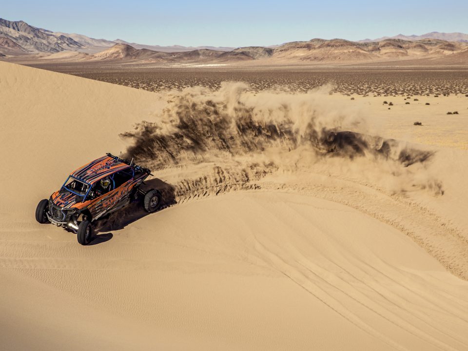 A side-by-side on a dune