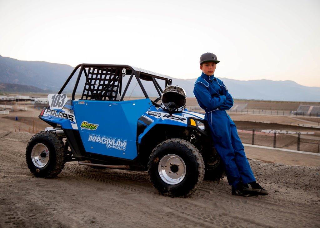 Child racer leaned against front of buggy