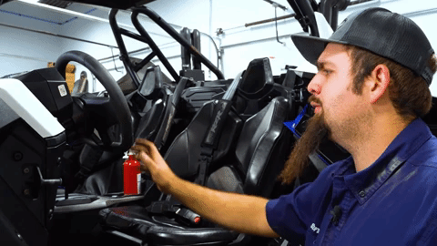 Braden gently straightens the Polaris RZR's steering wheel.