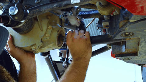 Braden uses both hands to push the prop shaft into the differential.