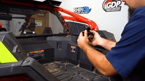 Braden uses a push pin remover tool to remove a push pin.