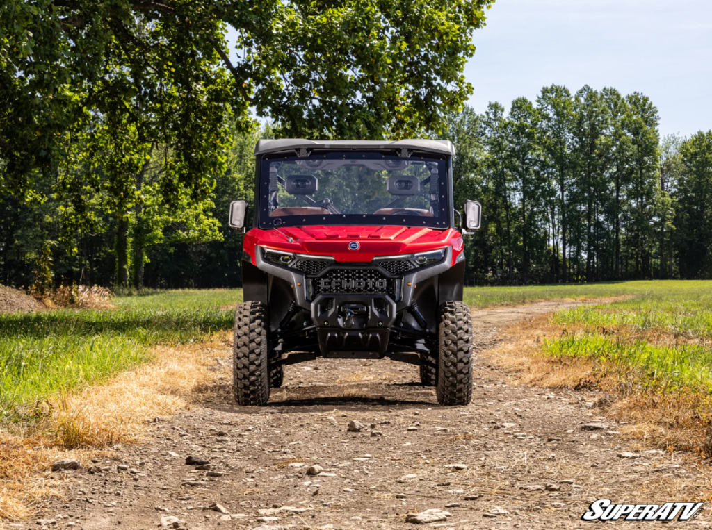 A red CFMOTO UTV with a full windshield installed.