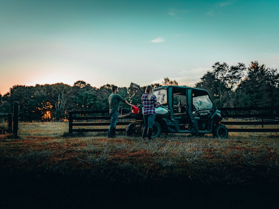 Tyler and matt using a UTV to take care of some farm work