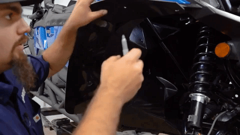Braden presses the fender flare back into the OEM fender to get a better fit.