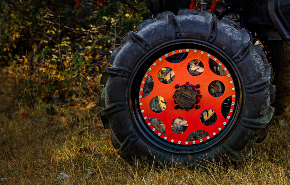 A T44 Series steel wheel from SuperATV with a Terminator tire