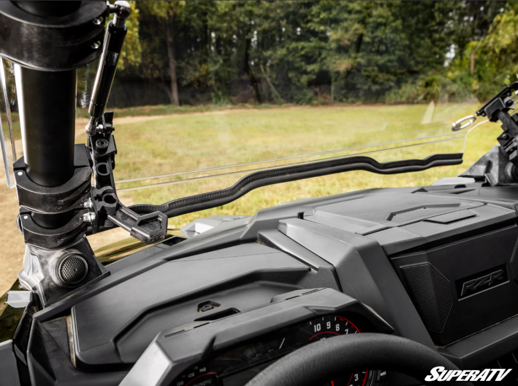 A view of a full windshield in the vented position from inside the UTV.