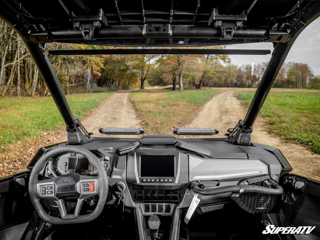 A view from inside the cab of a UTV showing the vents in the windshield.