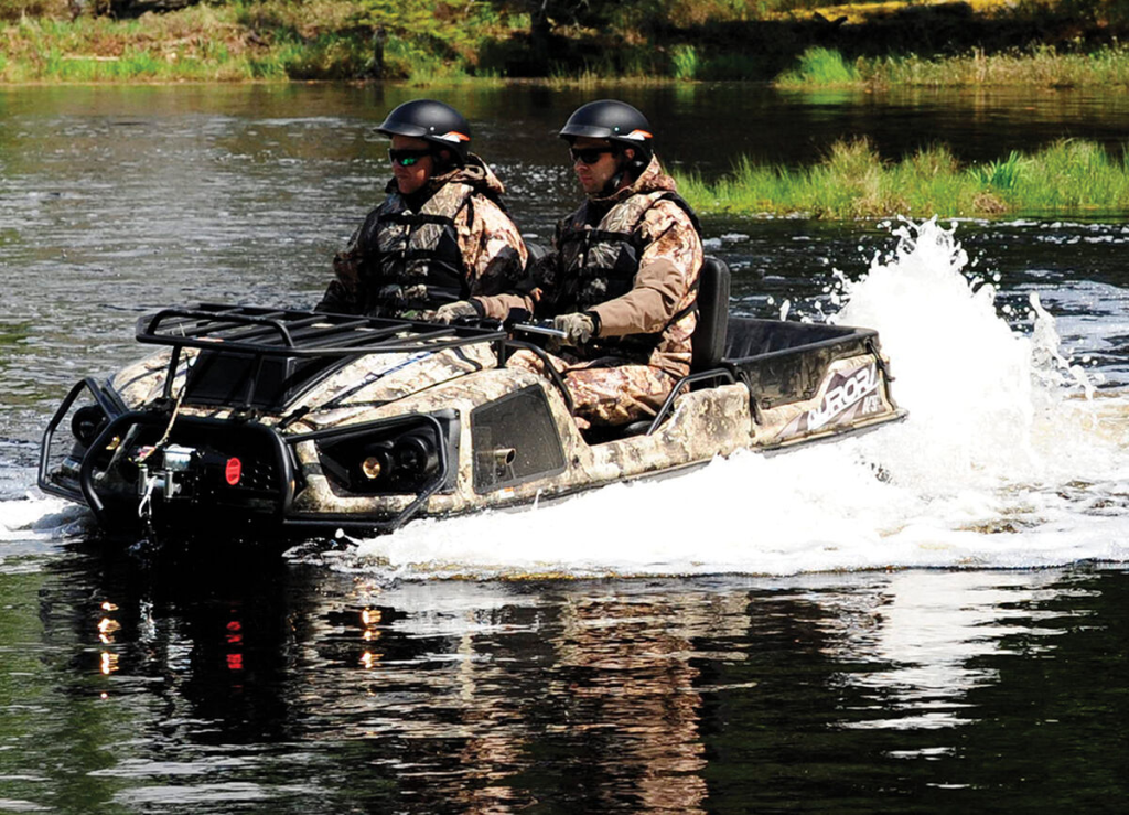 An Argo XTV plunges into shallow water with two passengers onboard.