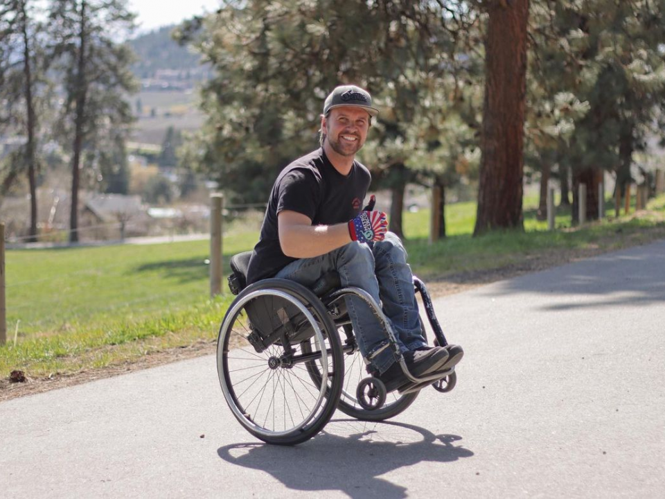 Buce cook doing a wheelie in his wheel chair