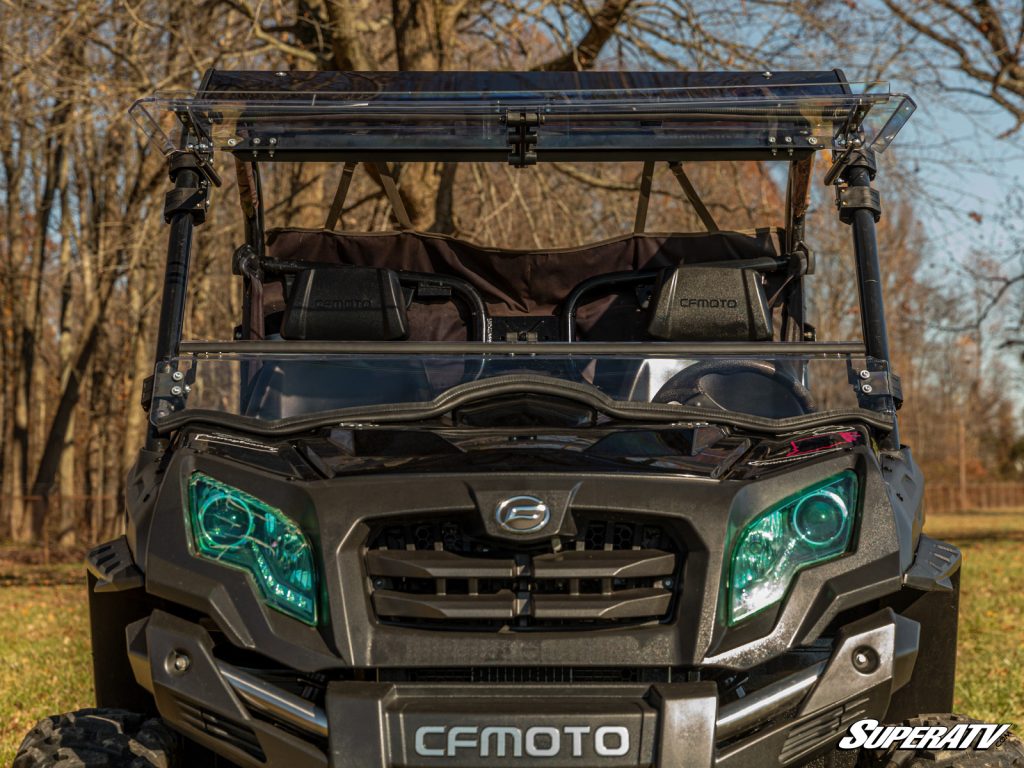 A CFMOTO UForce with a SuperATV flip windshield, rear windshield, and roof.
