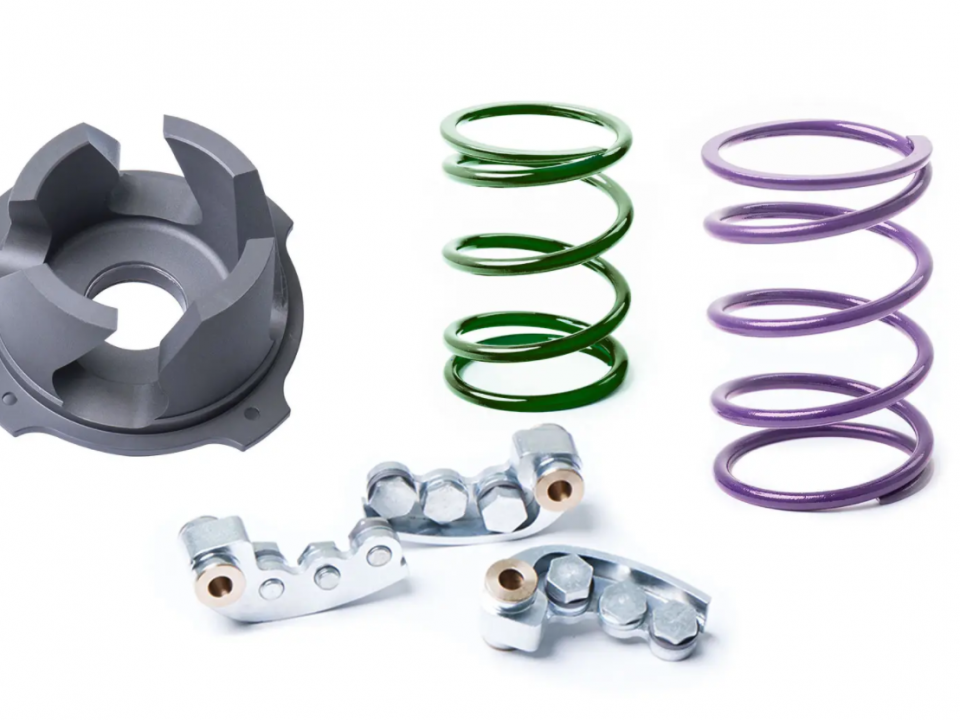 A SuperATV clutch kit with a primary spring, a secondary spring, a helix, and weighted clutch arms.