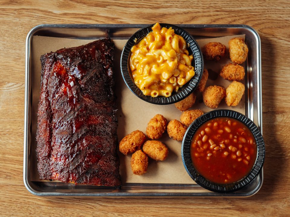 Delicious plate of BBQ served at on of the best places to eat near ride parks in North Carolina.