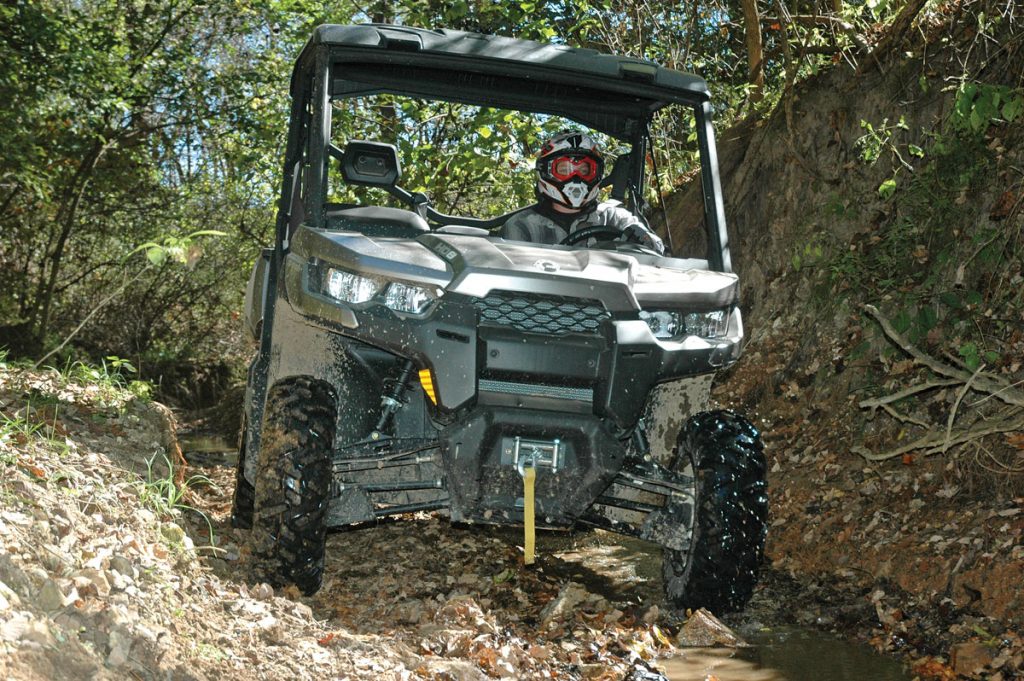 Can-Am Defender on forest trail
