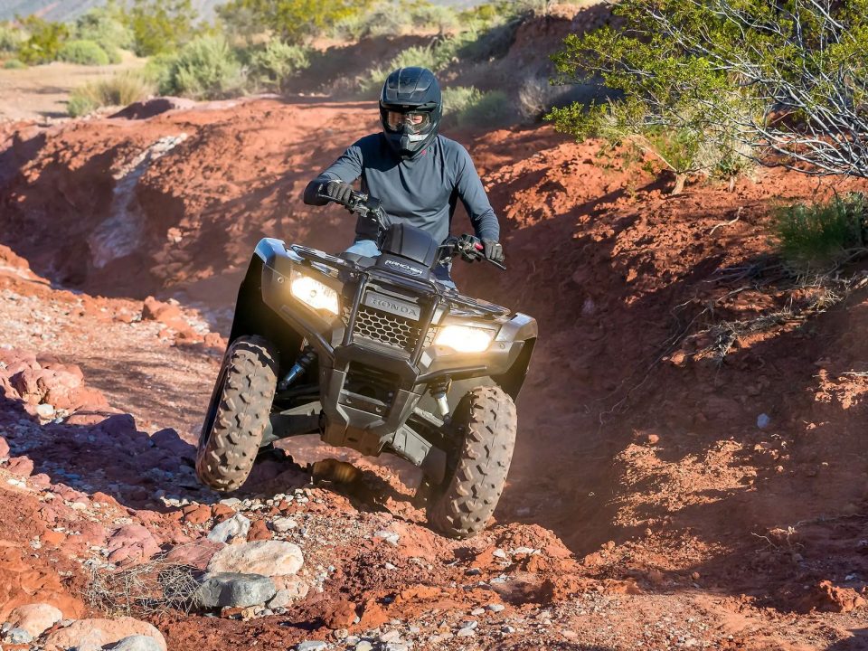 The Honda Rancher's specs allow it to navigate rocker terrain with ease.