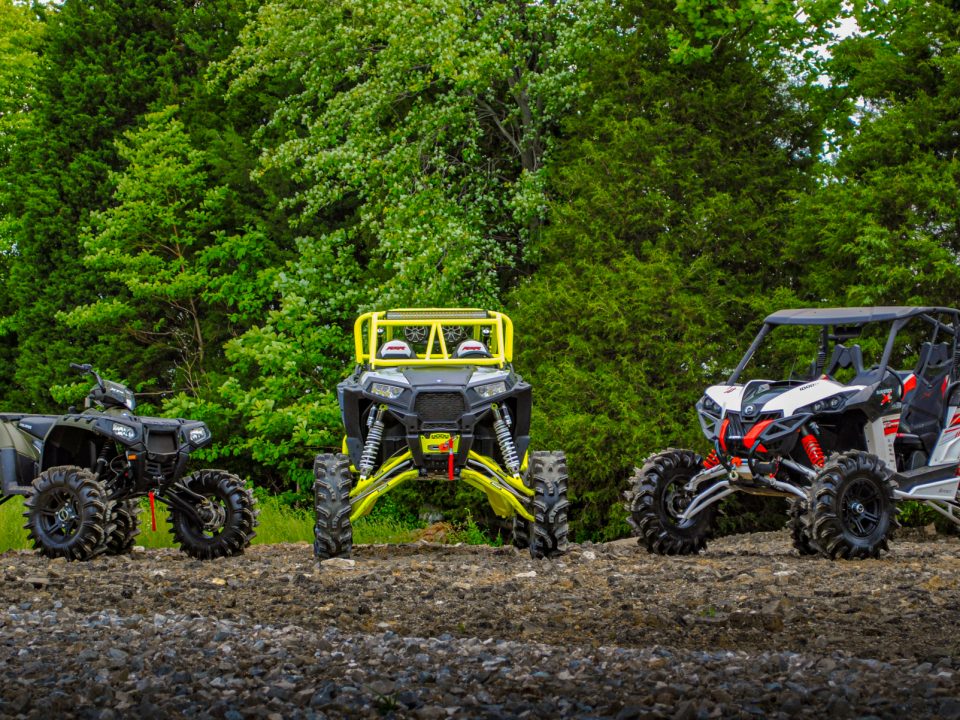 A Maverick, RZR and, Sportsman all with different parts