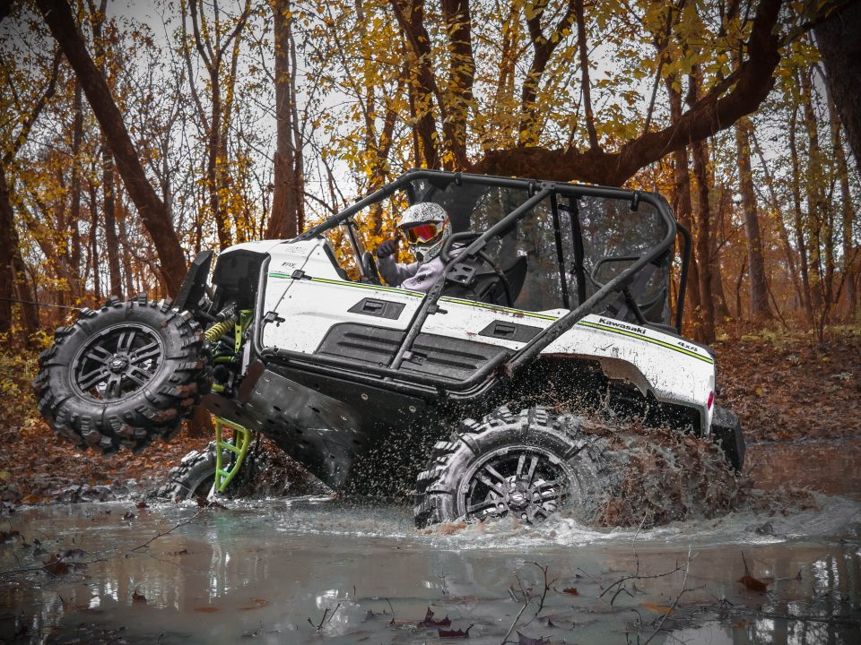 Kawasaki Teryx 4 sideways in mud hole