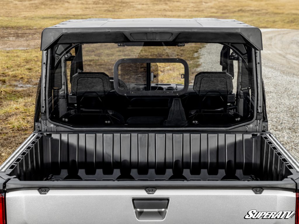 A Polaris Ranger viewed from the back. The rear windshield has a sliding window.