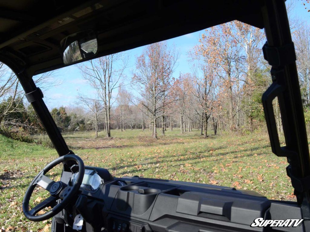 The view of a Polaris Ranger windshield from inside the cab.