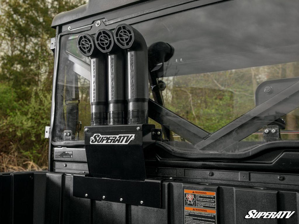 A snorkel kit installed on a Polaris Ranger behind the back window.