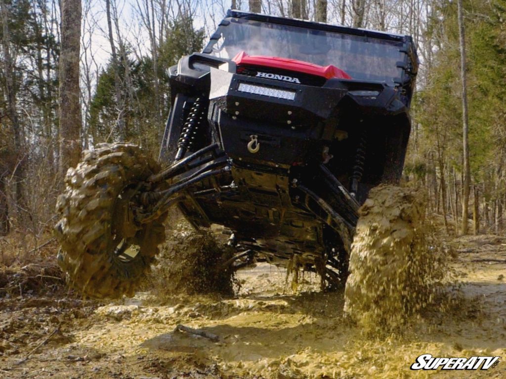 An upgraded Honda Pioneer takes on a gnarly mud bog. 