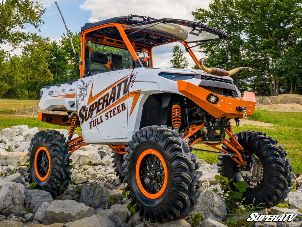 A custom ranger build parked on a rocky path.