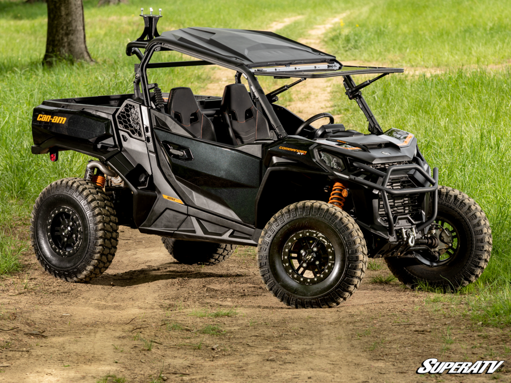 A Can-Am Defender with a flip-up SuperATV windshield.