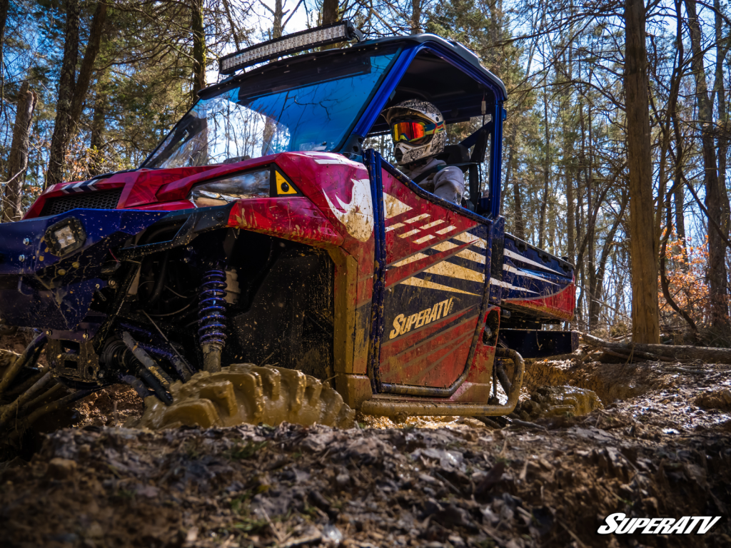 A lifted Ranger buried in mud up to its doors.