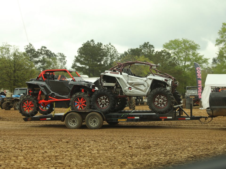 UTVs being hauled on a trailer