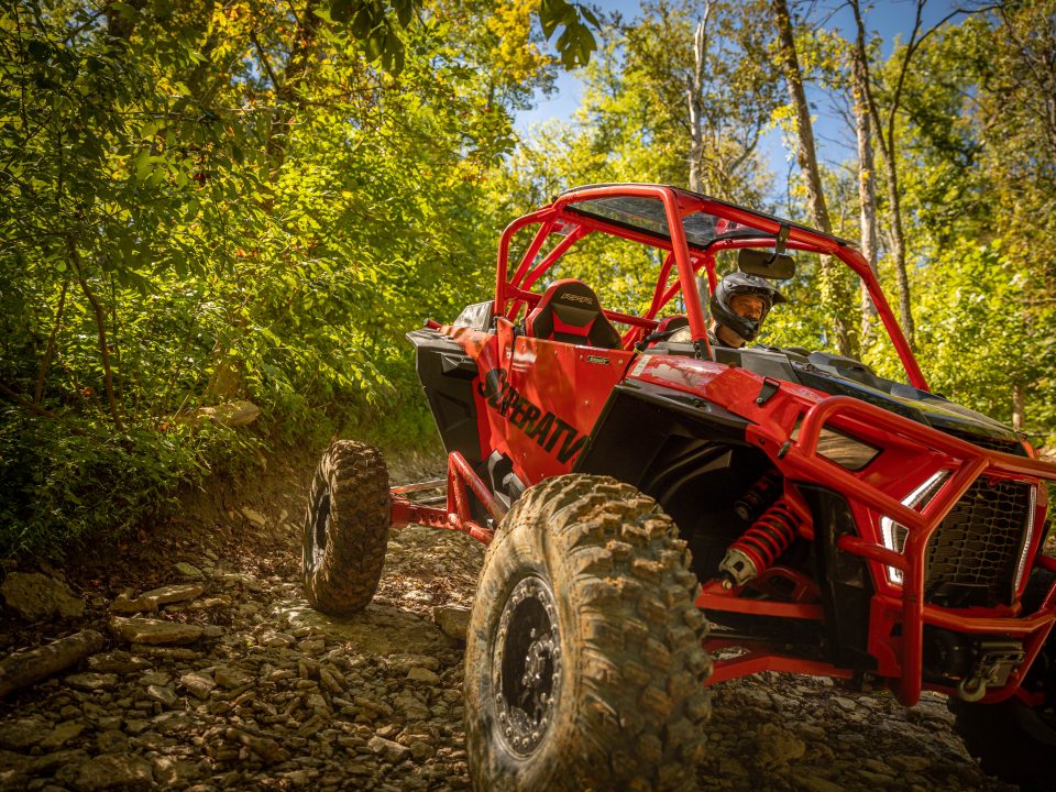 SuperATV Polaris RZR XP Turbo S coming down creek bed