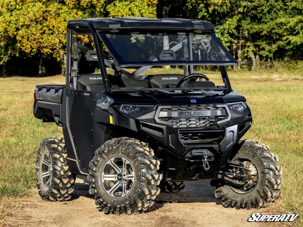 A Polaris Ranger XP 1000 with SuperATV's MaxDrive Power Flip Glass Windshield