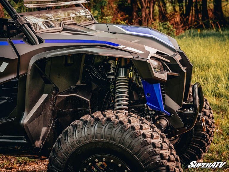 A Honda Talon with a spring spacer visible.
