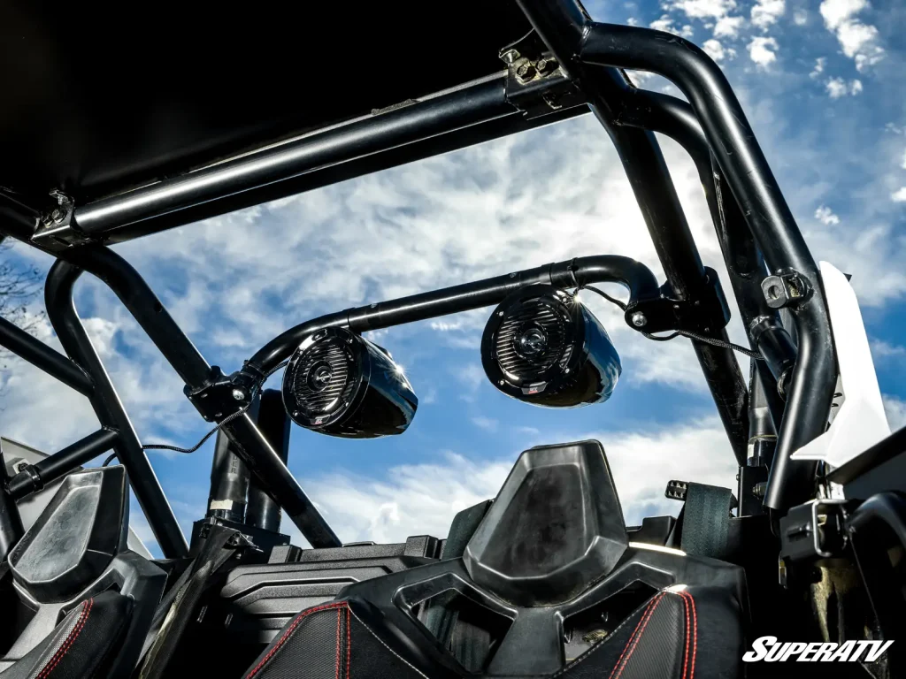 A pair of speakers mounted on a wakeboard-style bar.