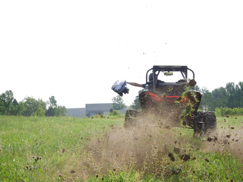 Polaris RZR kicking up dirt