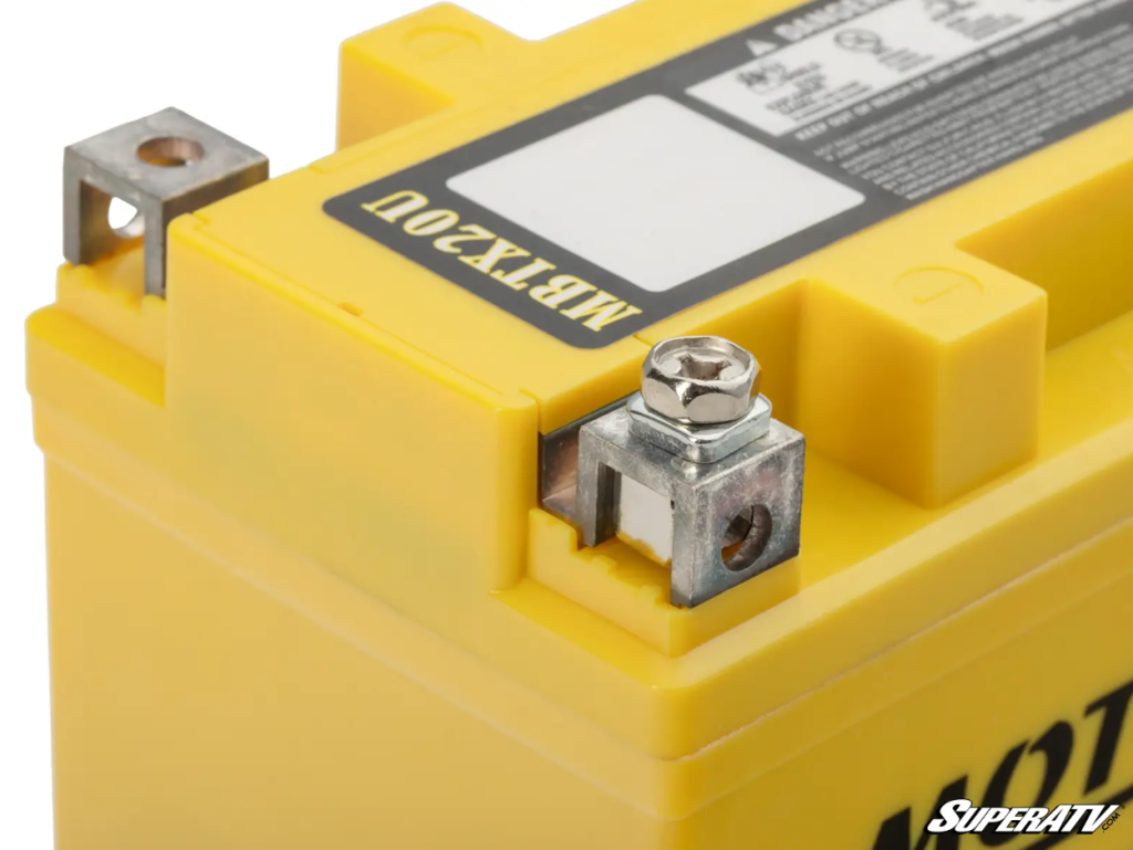 A closeup of the terminals on a Motobatt replacement battery for the Can-Am defender