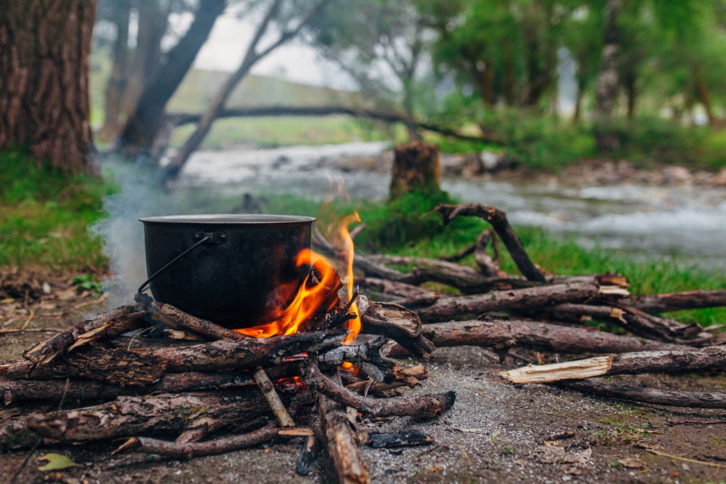 boiling water over open flame
