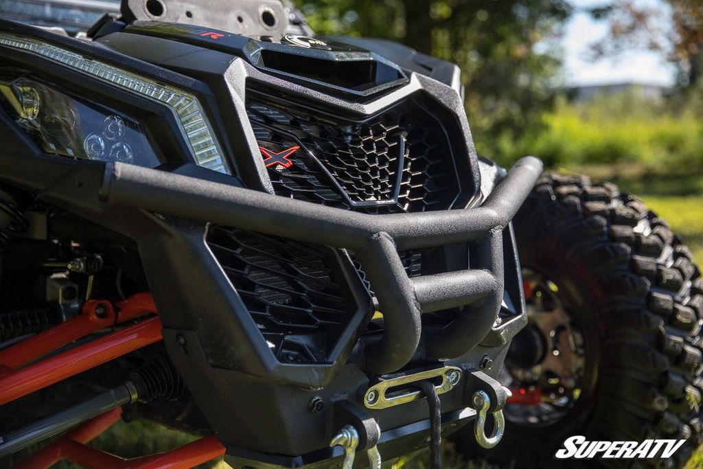 A 3/4 shot of the front fascia of a Can-am X3. It has a SuperATV bumper with a winch installed mounted to the front.