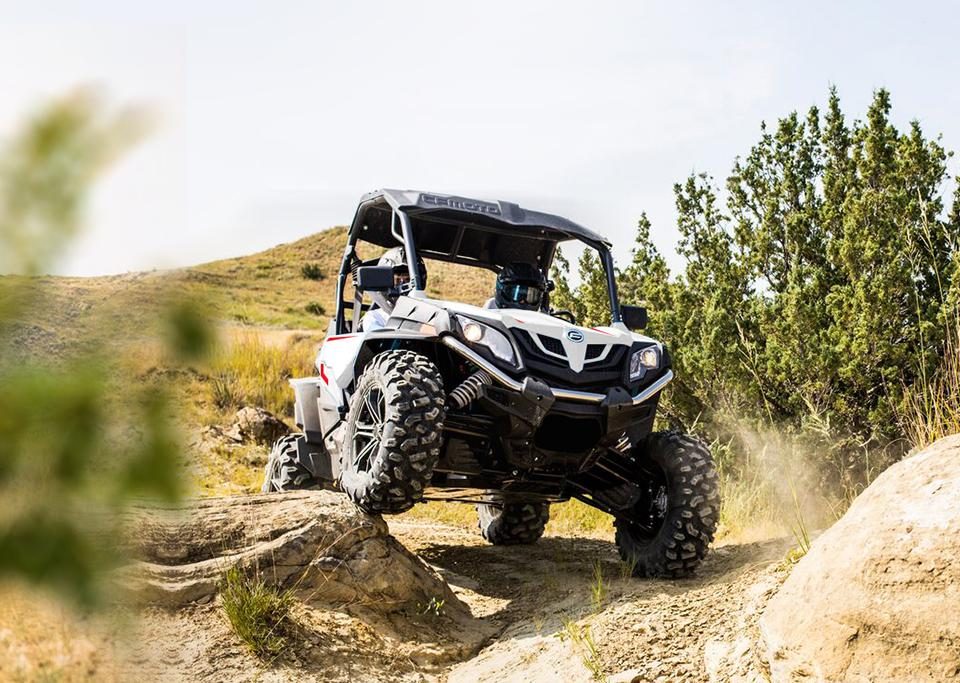 White CFMOTO UTV on rough terrain