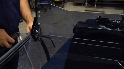 He cuts off the excess bulb seal with diagonal cutting pliers for a custom fit.