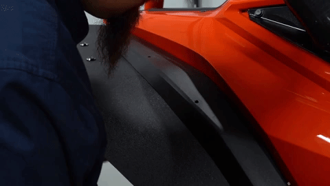More holes are being drilled through the fender flare and the OEM fender.