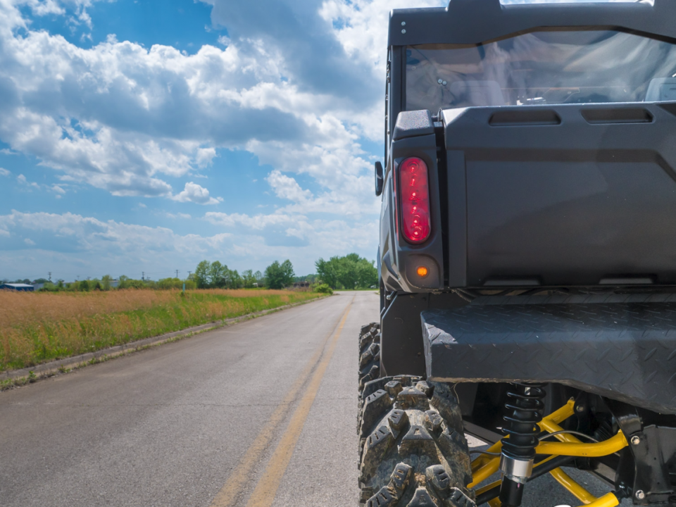 Rear shot of Can-Am Defender with rear turn signal kit by SuperATV