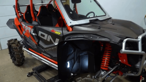 The SuperATV logo flashes and appears to glitch in a stylized way over the Honda Talon with the fender flares fully installed.