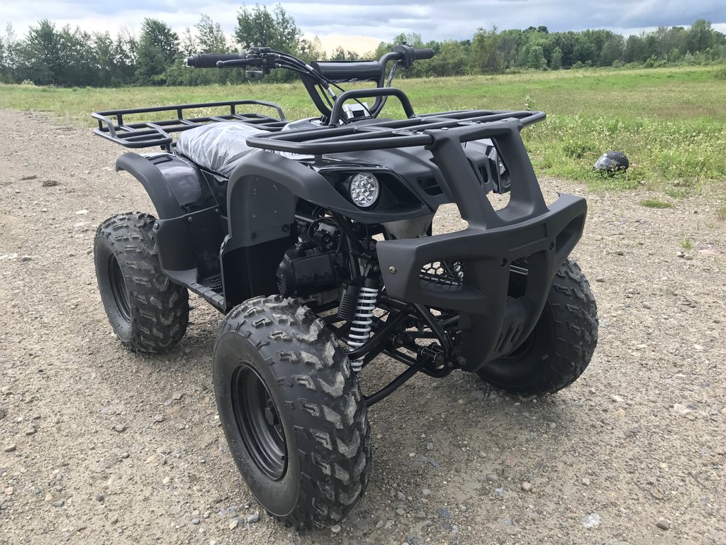 Black UTV parked on trail