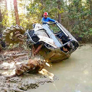 SuperATV Goose rollover in muddy creek