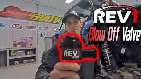 Tyler holding SuperATV's Rev1 Blow Off Valve