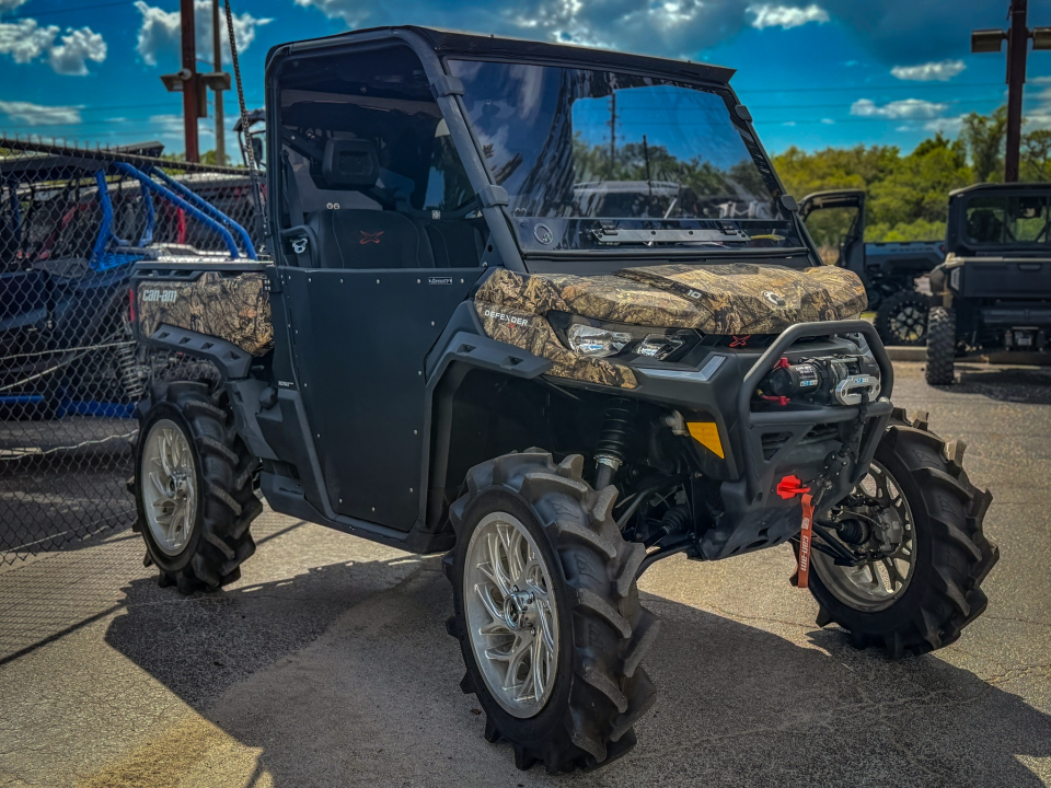 A Can-Am Defender HD10 decked out in SuperATV parts.