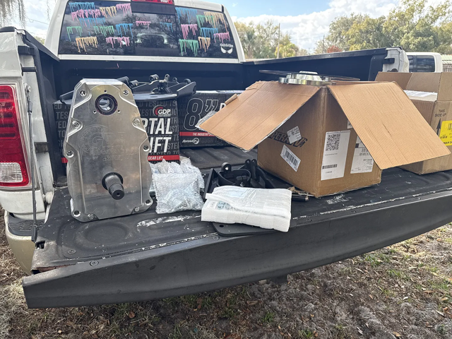 A truck bed filled with half-unpacked boxes of 8" GDP Portals