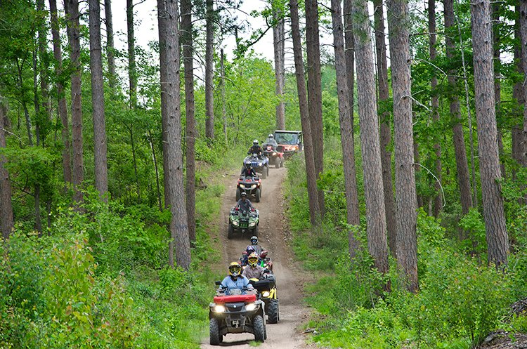 a convoy of ATVs and a UTV on the Blue Mountain OHV Trail System